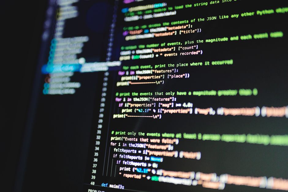 Lines of code on a dark monitor illustrating how to reduce AI token usage in OpenClaw
